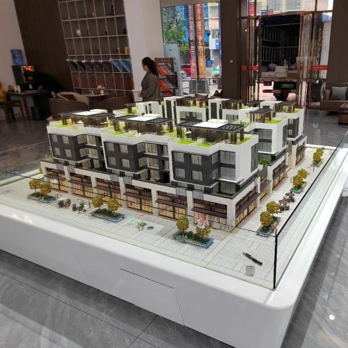 Modern villa model building scale model with green landscape and garden