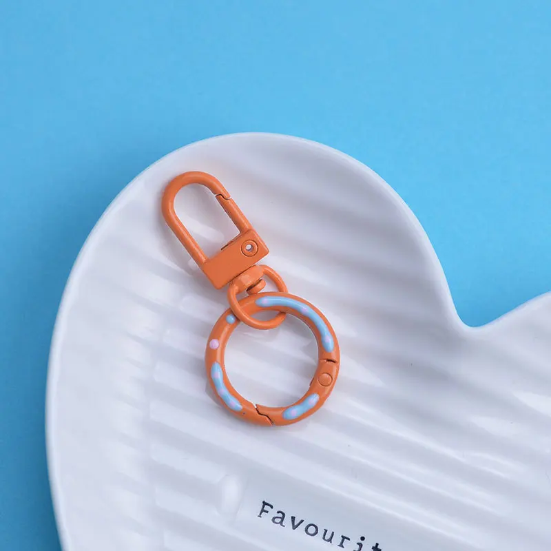

Candy colored door buckle with spring buckle DIY keychain ring doll luggage pendant keychain accessory, exquisite packaging