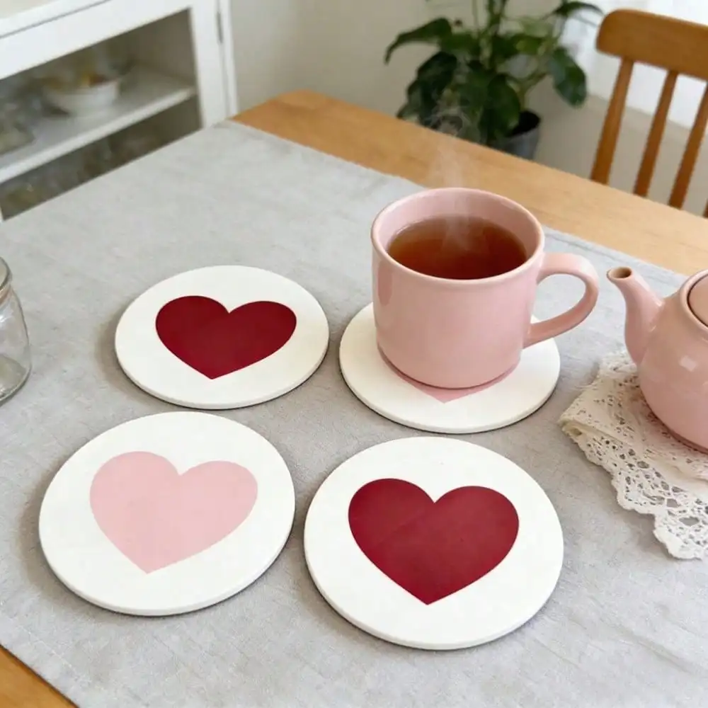 Minimalist solid-color round acrylic coaster with a large heart design—absorbent, non-slip, and heat-insulating.
