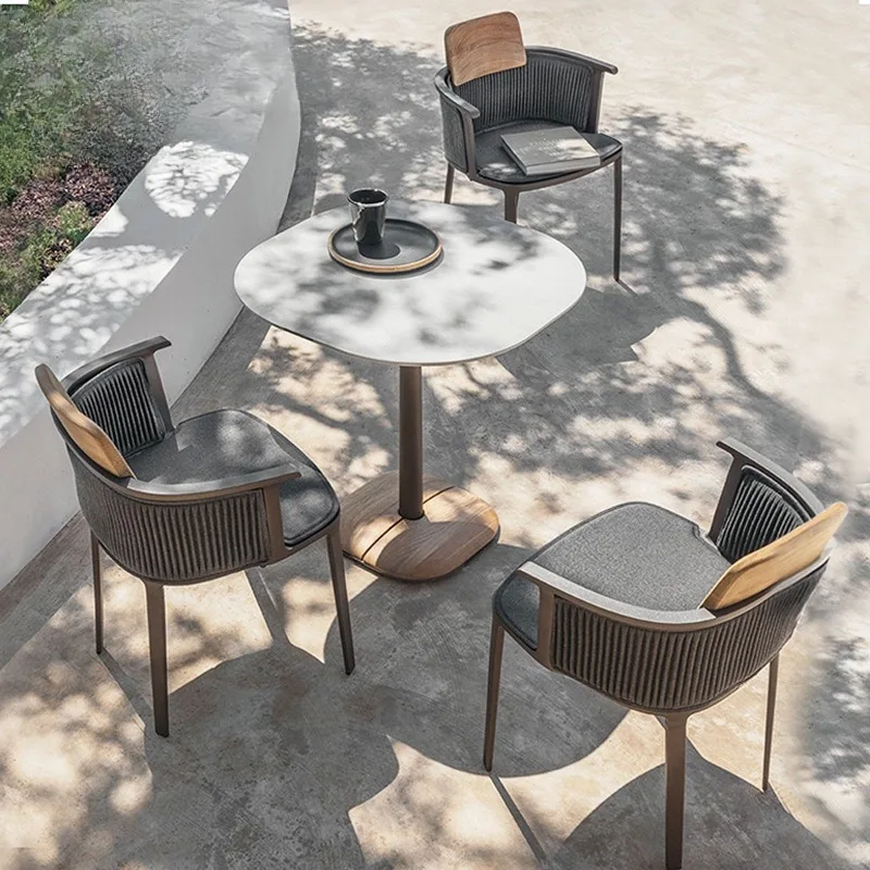 

Nordic outdoor rattan tables and chairs terrace courtyard waterproof teak single rattan chair coffee shop leisure solid wood