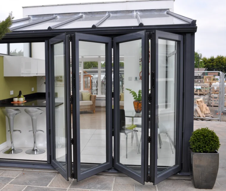 Soundproof Manual Double Bi-Fold Sliding Door with Glass Panels. Folds Flat Glides Smoothly Modern Design Customizable Finishes