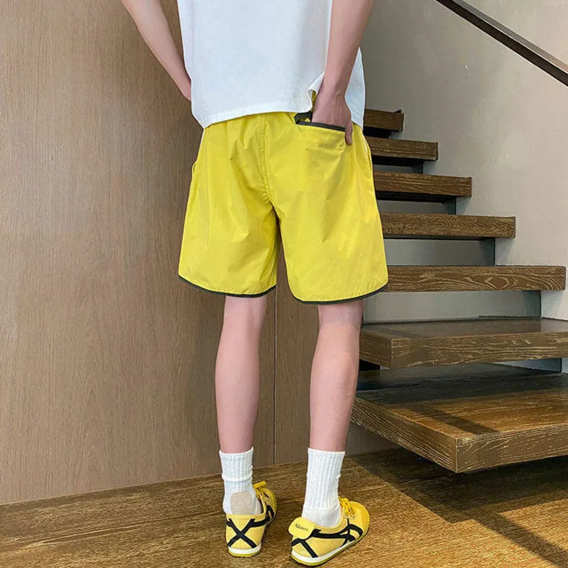 LUZHEN 2025 Estate Stripe Splicing Pantaloncini ad asciugatura rapida Sport Moda uomo Pantaloni casual larghi dritti Vita elastica Nuovo JY2893