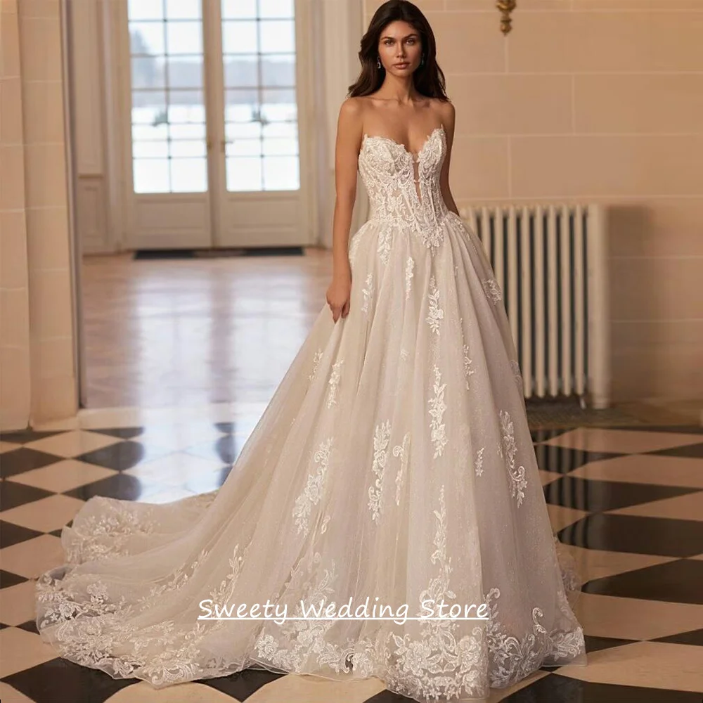 

Luxury Wedding Dresses Charming Sweetheart Sleeveless Sequined Applique Sweep Train Zipper Buttons A Line Bridal Gown