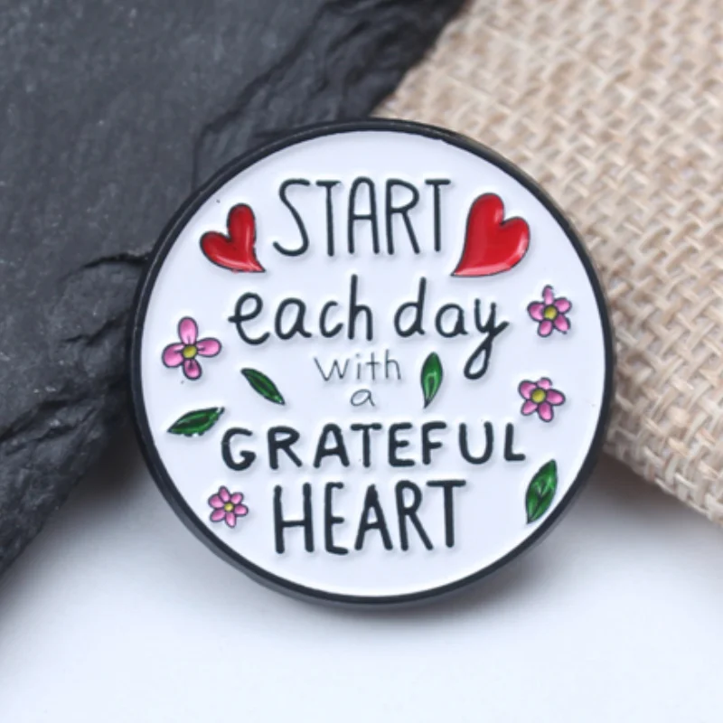 Philosophical quote: Start each day with a grateful heart. Pin badge