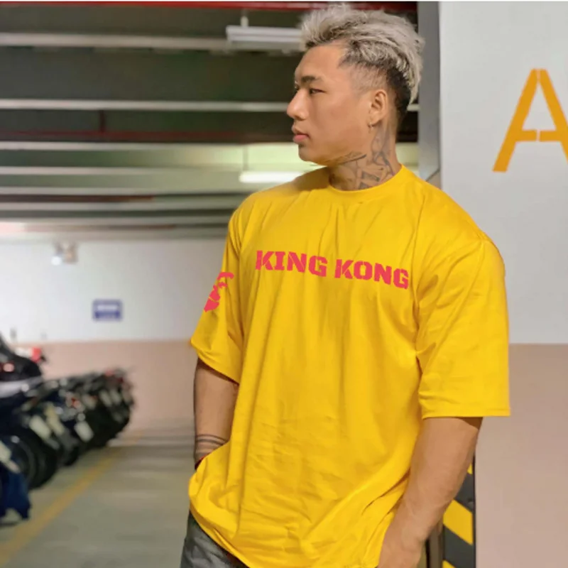 T-shirt sportiva a maniche corte da uomo alla moda con vestibilità ampia per abbigliamento da allenamento da corsa da palestra a mezza manica in