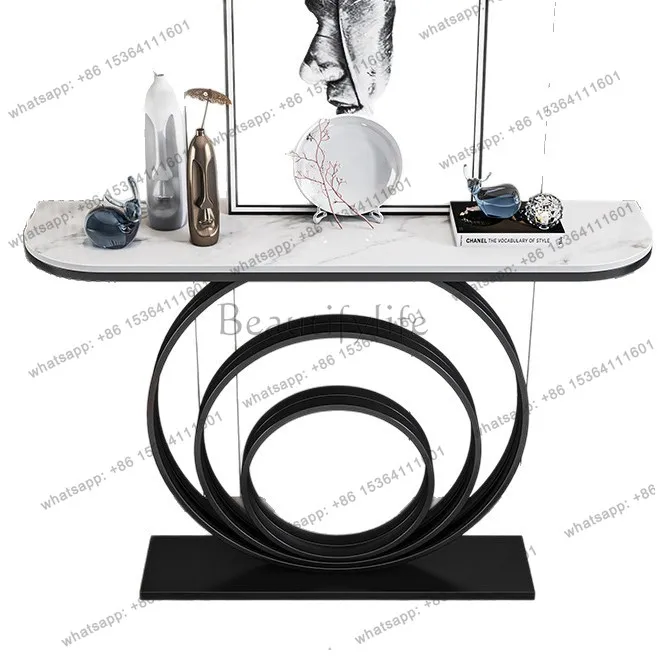 The entrance table is against wall, and the modern simple high-end light luxury style is provided for table