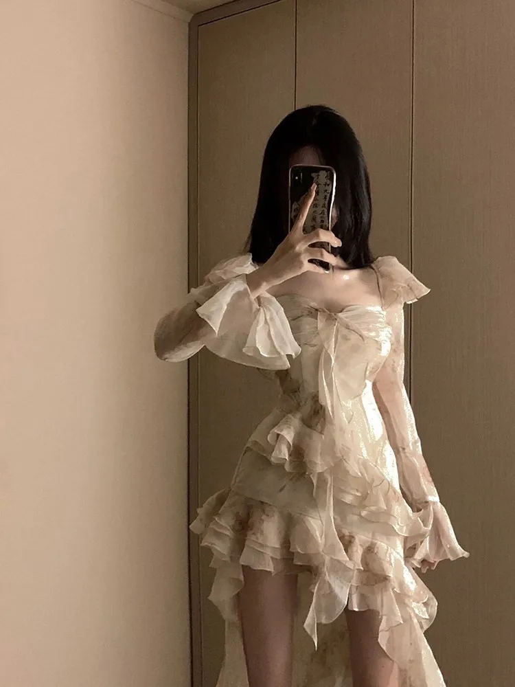 

A ruffled long-sleeved dress with shorter front and longer back for the birthday party