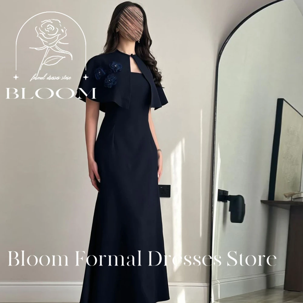 Bloom Customized Sophisticated Navy Blue Dress features a unique cape detail with decorative blue flowers. The straight neckline