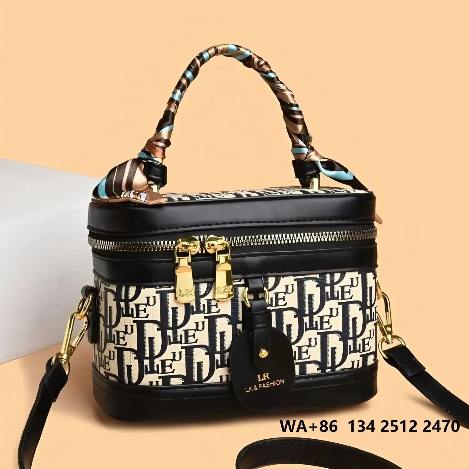 

Letter single-letter square makeup bag, handle wrapped with colorful scarf, black leather accents, double gold zippers, adjustable crossbody strap.