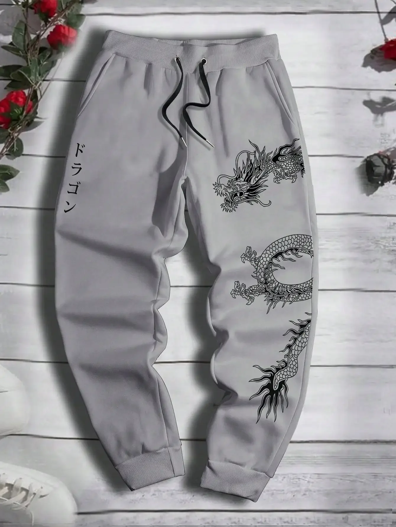 Pantaloni sportivi primaverili e autunnali versatili in vita con coulisse in pile confortevole stampato con motivo drago da uomo alla moda S-3XL