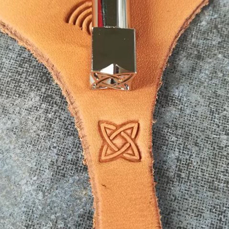 

Leathercraft tools and hardware, precision steel engraving and embossing tools, geometric multi-faceted decorative patterns.