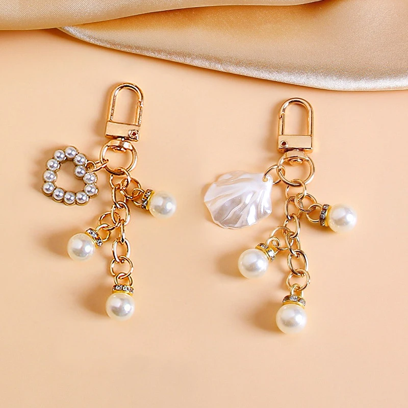 Милый-брелок-с-кисточкой-из-искусственного-жемчуга-модный-брелок-в-форме-сердца-для-женщин-сумка-чехол-для-наушников-кулон-подарок-другу-сувенир