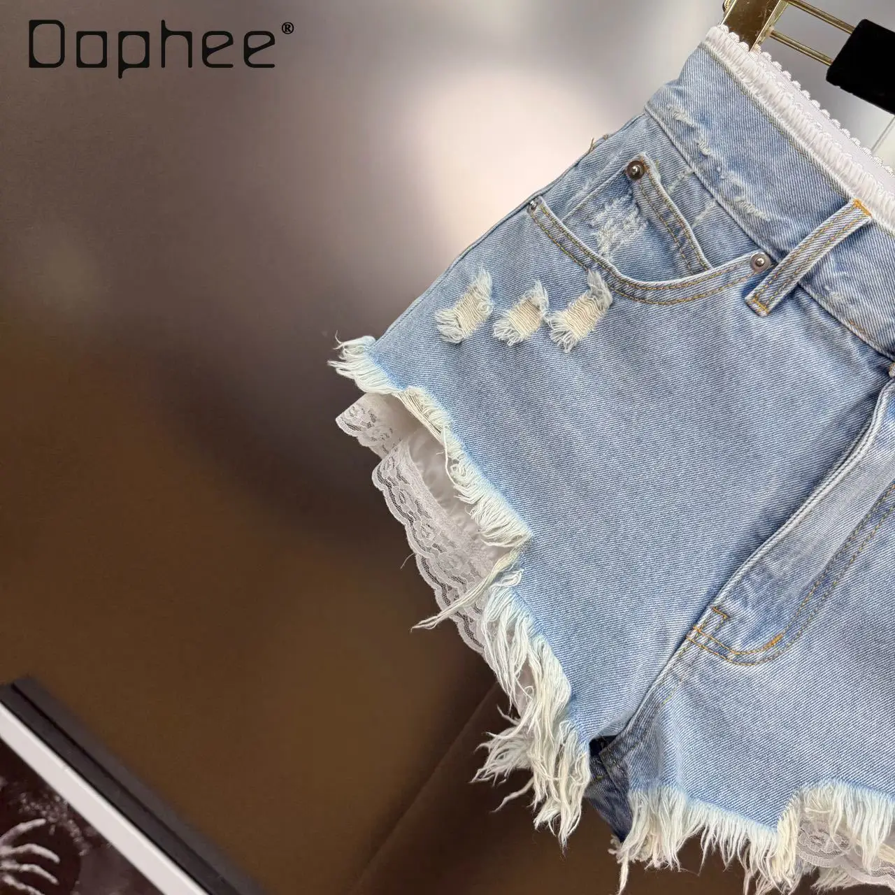 Estate 2025 Nuovo francese retrò pizzo splicing strappato bordo grezzo falso pantaloncini di jeans in due pezzi Spice Girl Y2K jeans slim a vita alta