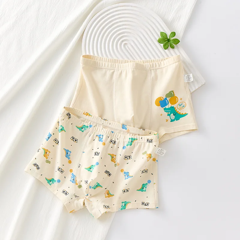 Lindo patrón de dinosaurio de dibujos animados para niños tamaño mediano y grande 95% algodón Clase A algodón calzoncillos tipo bóxer cómodos y transpirables