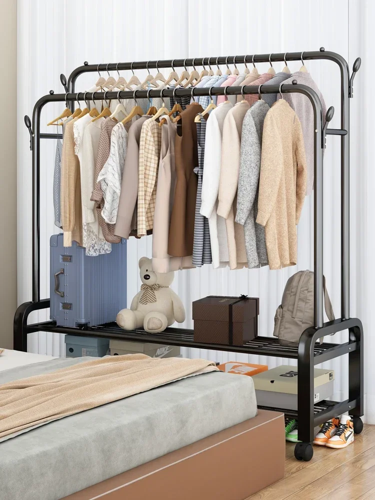 

A floor folding indoor single pole clothes hanger for hanging clothes in a bedroom. A simple cooling rack for household clothes