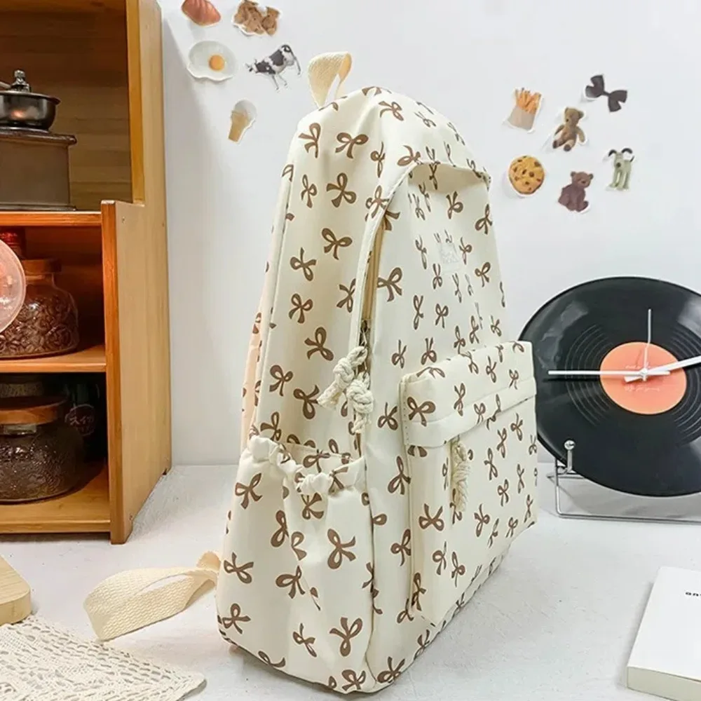 

Симпатичный студенческий рюкзак с принтом в виде банта, большой вместимости, из нейлона, женский школьный рюкзак с регулируемыми лямками, женский рюкзак для путешествий