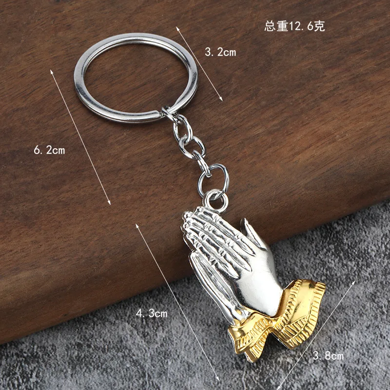 Innovative individual, palms joined together, welcomes both male and female keychains.