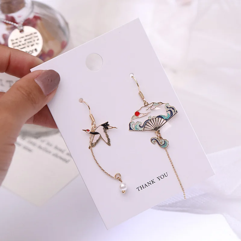 Guofeng new creative crane antique fan asymmetrical long tassel imitation pearl painting oil ear hook earrings female