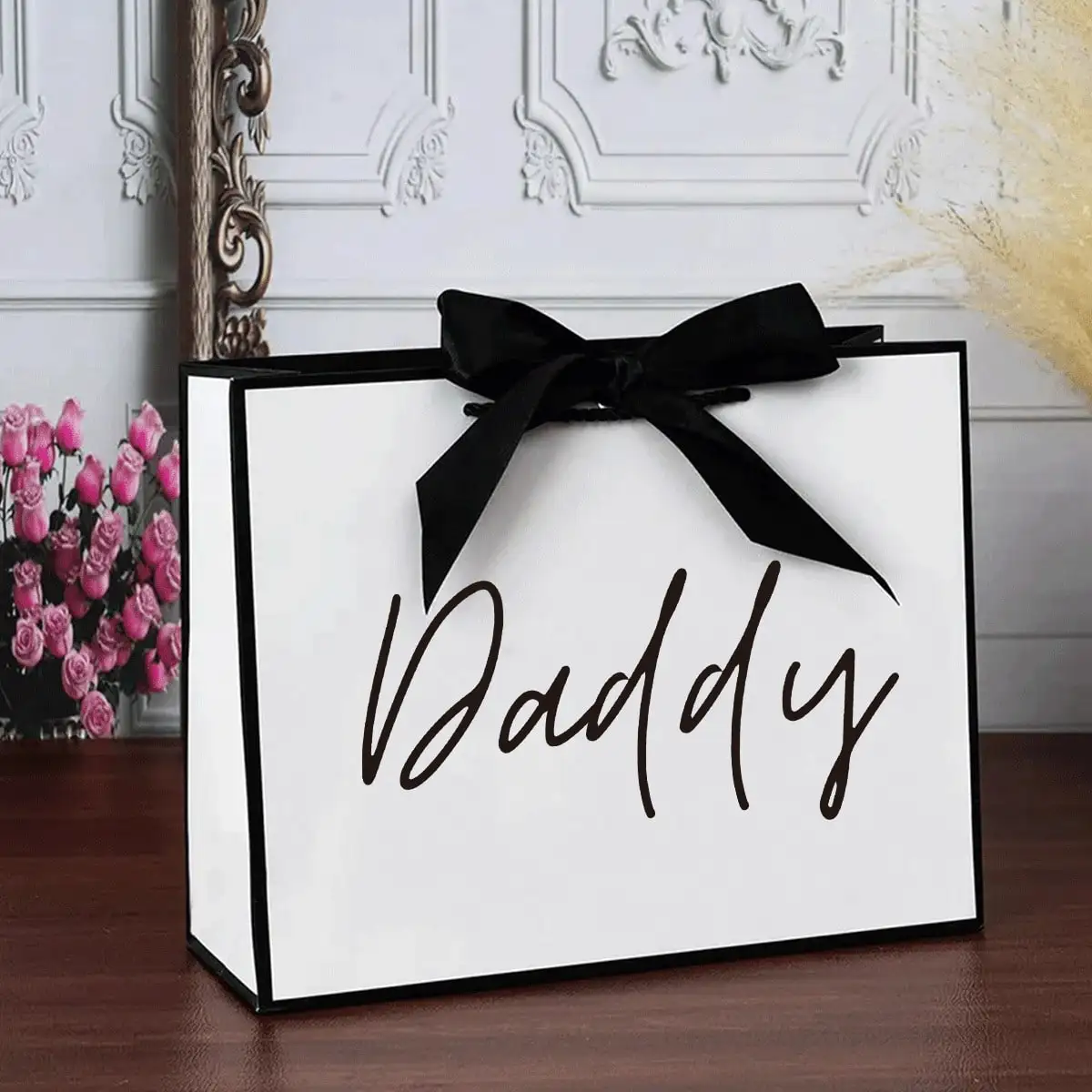 

Elegant White Paper Gift Bag with Black Ribbon Bow for Father's Day, Birthday or Appreciation