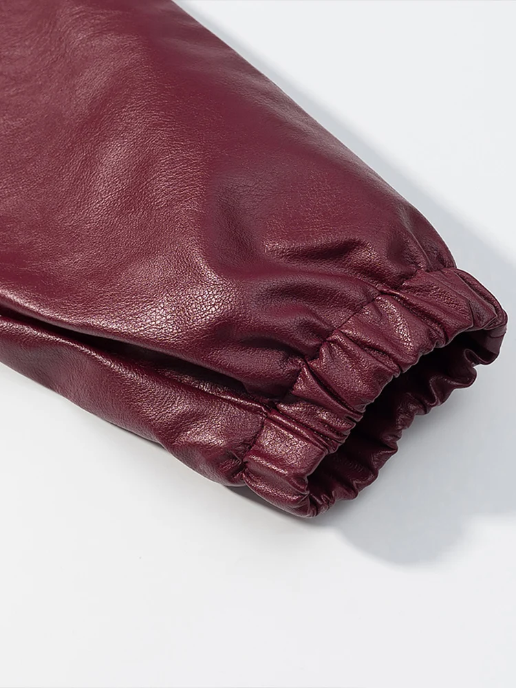 Nouvelle veste en cuir ample à col haut de couleur unie pour femmes de style européen à la mode et polyvalente avec détails de poche.