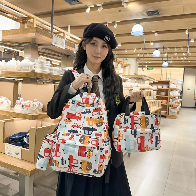 

Handheld backpack gradual change three-piece student bag female fresh and sweet floral backpack light make-up lesson