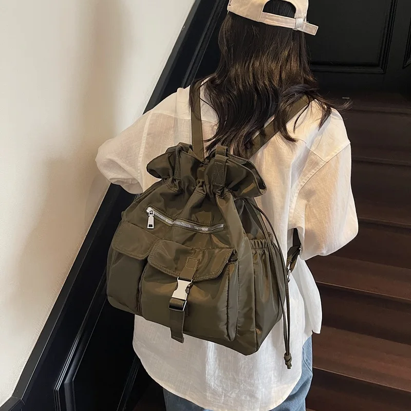 

Nylon fabric large-capacity women's backpack, travel drawstring closure, multi-pocket, lightweight student schoolbag