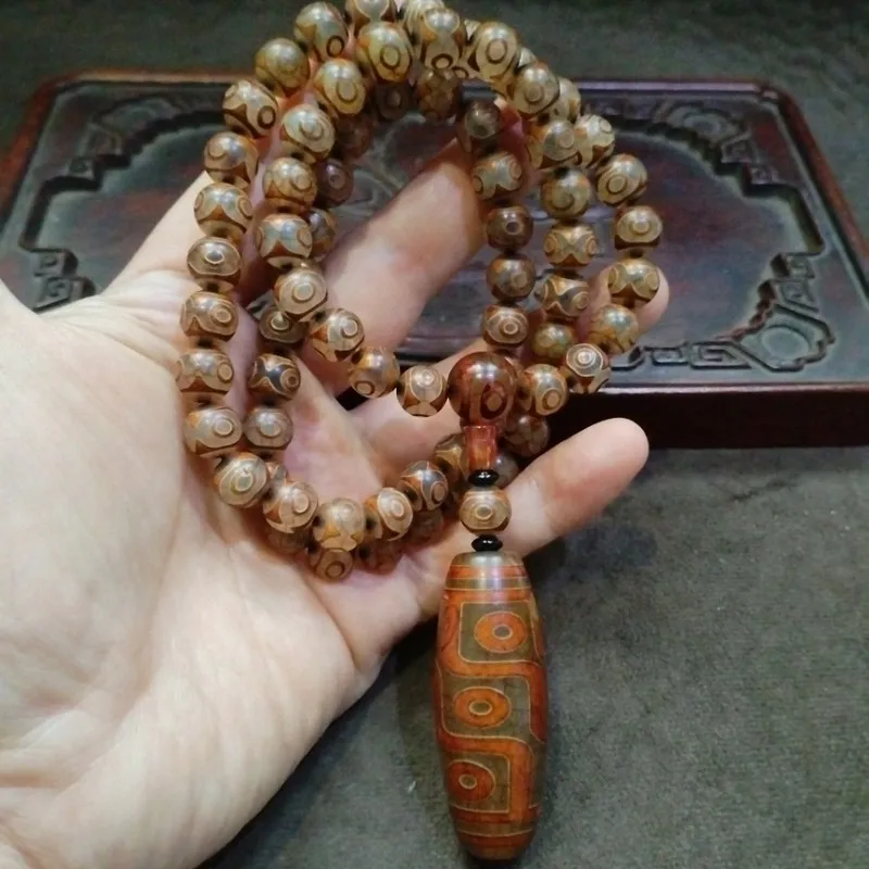 Antique Tibetan-style nine- agate Dzi three-eye Buddhist prayer beads paired with a necklace and sweater chain