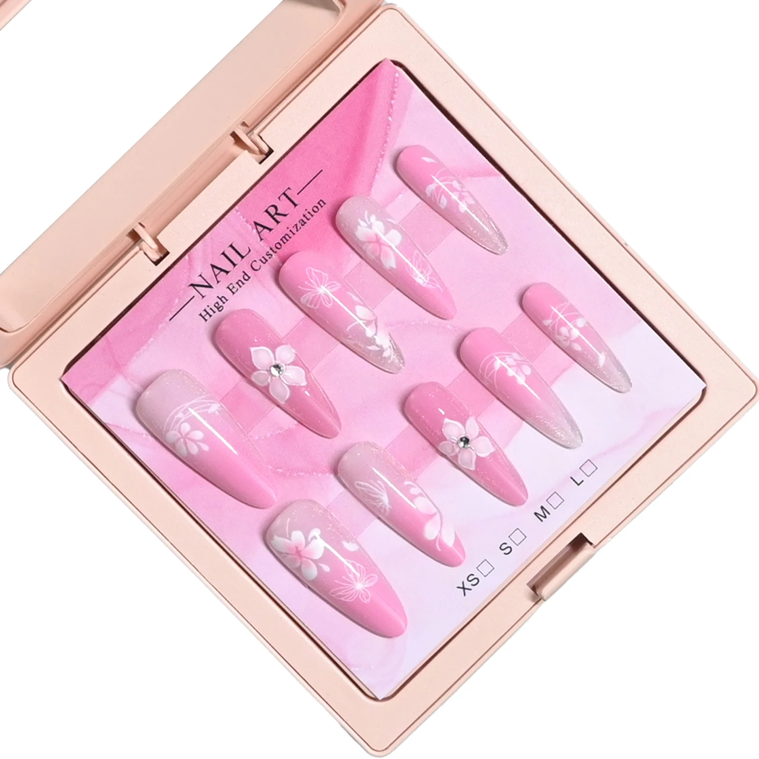 10 handmade almond nails in pink case. Gradient peach base with glitter tips, hand-drawn white cherry blossoms & rhinestones. Re