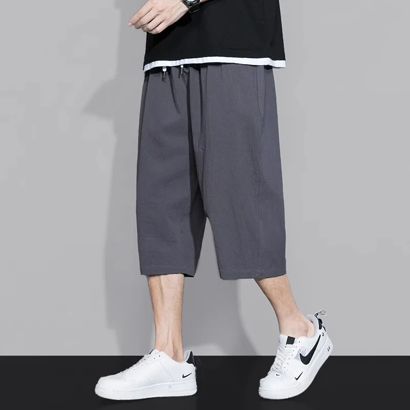 กางเกงขาสั้นผู้ชายทรงตรงแบบสบายๆ น้ำหนักเบา ผ้าบางเบา มีเชือกผูกเอว เหมาะสำหรับใส่ลำลอง ออกกำลังกาย หรือไปเที่ยวชายหาด