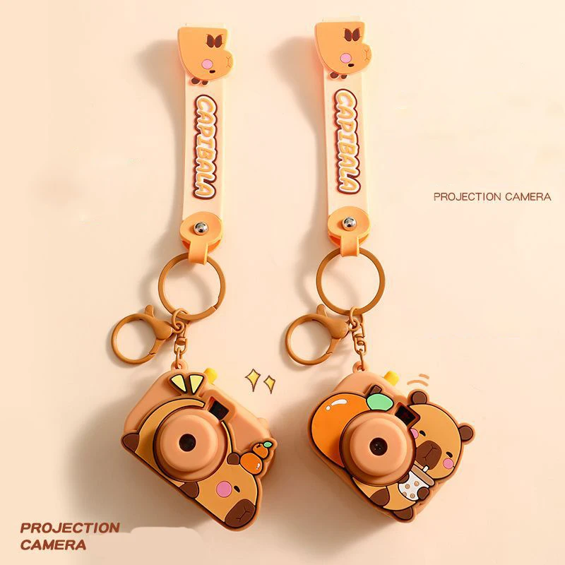 Cute Capibara Drink Milk Tea Orange Fruit Projection Camera Key Chain Pendant Toy Capybara Overhead Tangerine Crawling Keyring