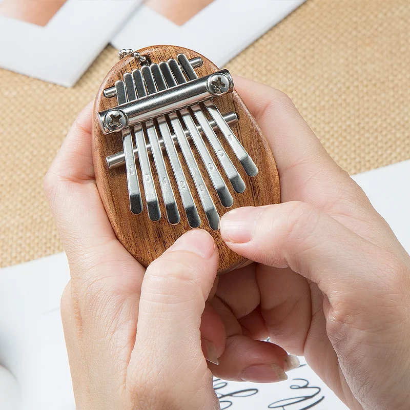 8 teclas Mini Kalimba exquisito dedo pulgar Piano Marimba Musical buen accesorio colgante regalo