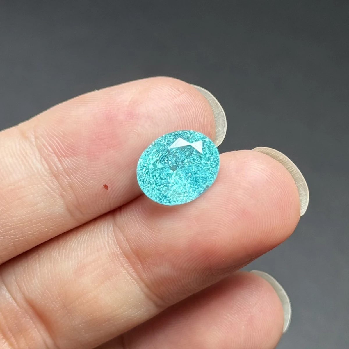 

Искусственно выращенный овальный синий камень Параиба, огранка «лед», россыпью