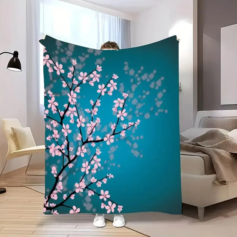 A Japanese cherry blossom pattern blanket, suitable for sofas, beds, travel, and camping - modern Japanese home décor.