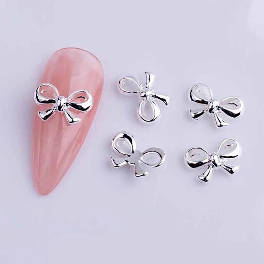 Nœuds de ruban en alliage pour Nail Art, breloque 3D or/argent, Mini nœud papillon creux, pièces de décoration d'ongles, bricolage, Design japonais, 20 pièces