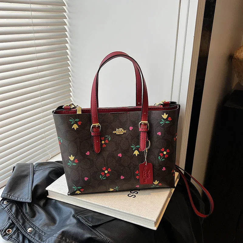 La nuova borsa da donna tote con motivo di marca di lusso del 2025 è una borsa a tracolla monospalla alla moda