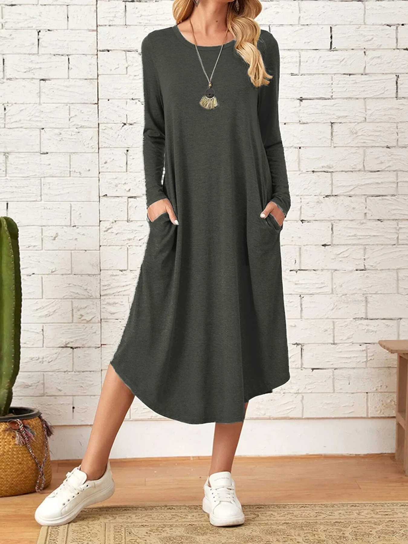 

Autumn and winter new women's round neck casual oblique pocket curved hem long sleeve dress