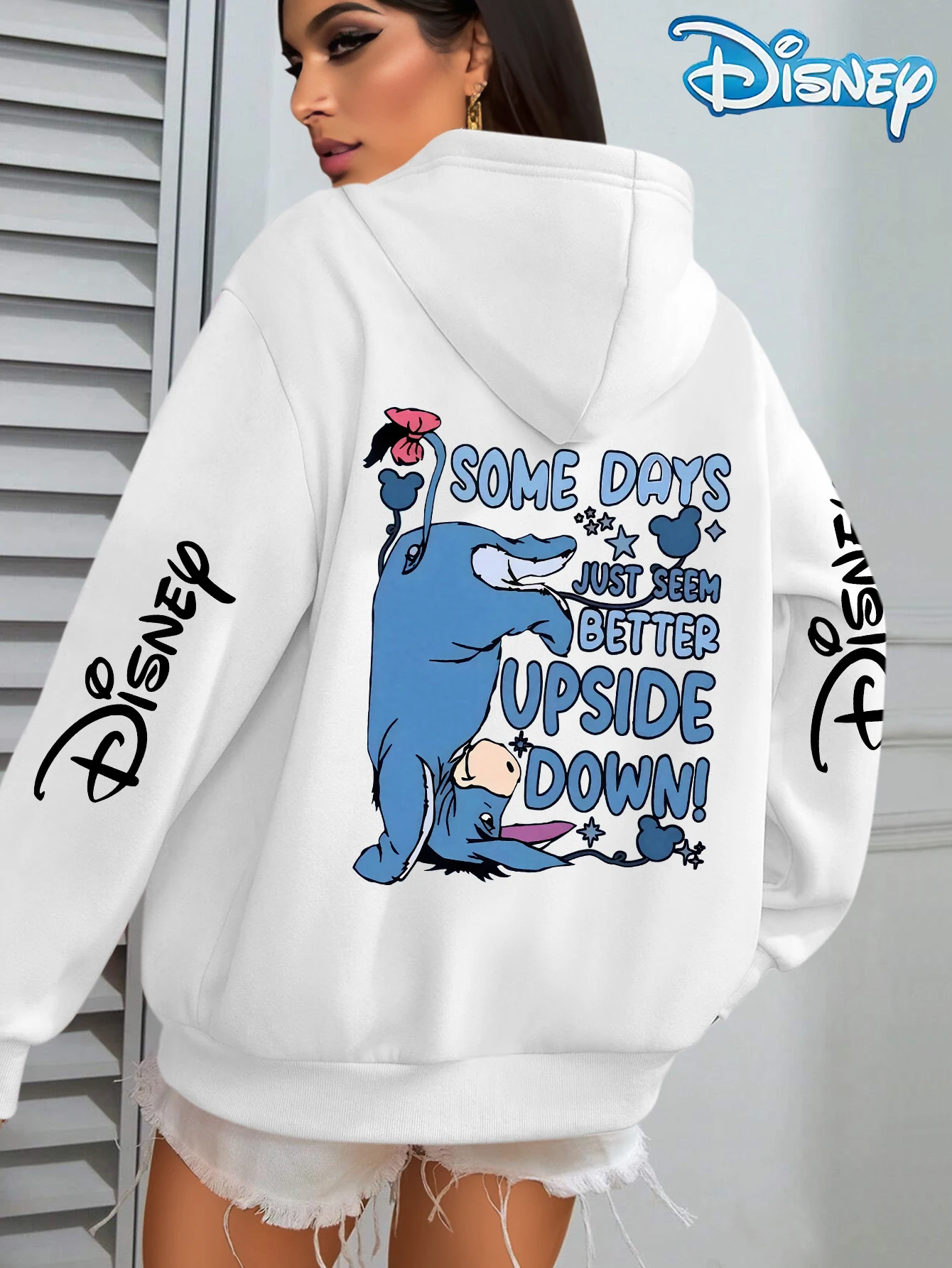 Felpa con cappuccio unisex in pile di cotone Disney Upside Down Donkey bianca con fiore rosa sulla manica della coda Design con scritte Vestibilità ampia