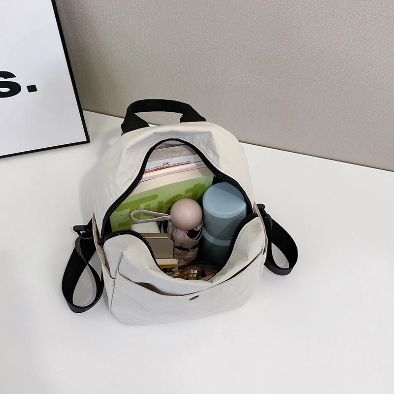 กระเป๋าเป้ไนลอนเกาหลีสำหรับผู้หญิง สีพื้นเรียบง่าย กระเป๋าเป้สะพายหลังขนาดเล็กสำหรับนักเรียนวัยรุ่น กระเป๋าเดินทาง กระเป๋าเป้สำหรับคุณแม่