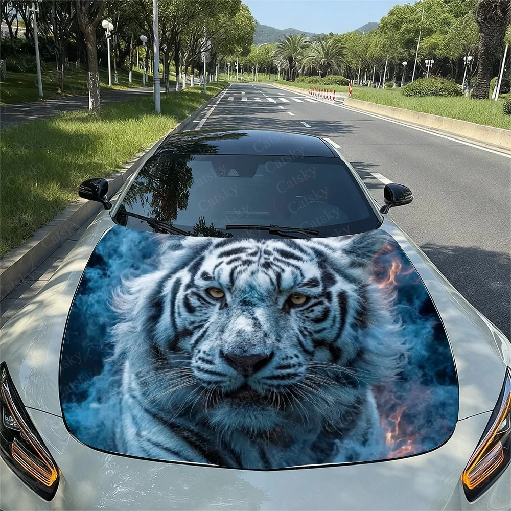 This striking car hood wrap features a fierce white tiger amidst blue and orange flames, creating a bold and eye-catching design
