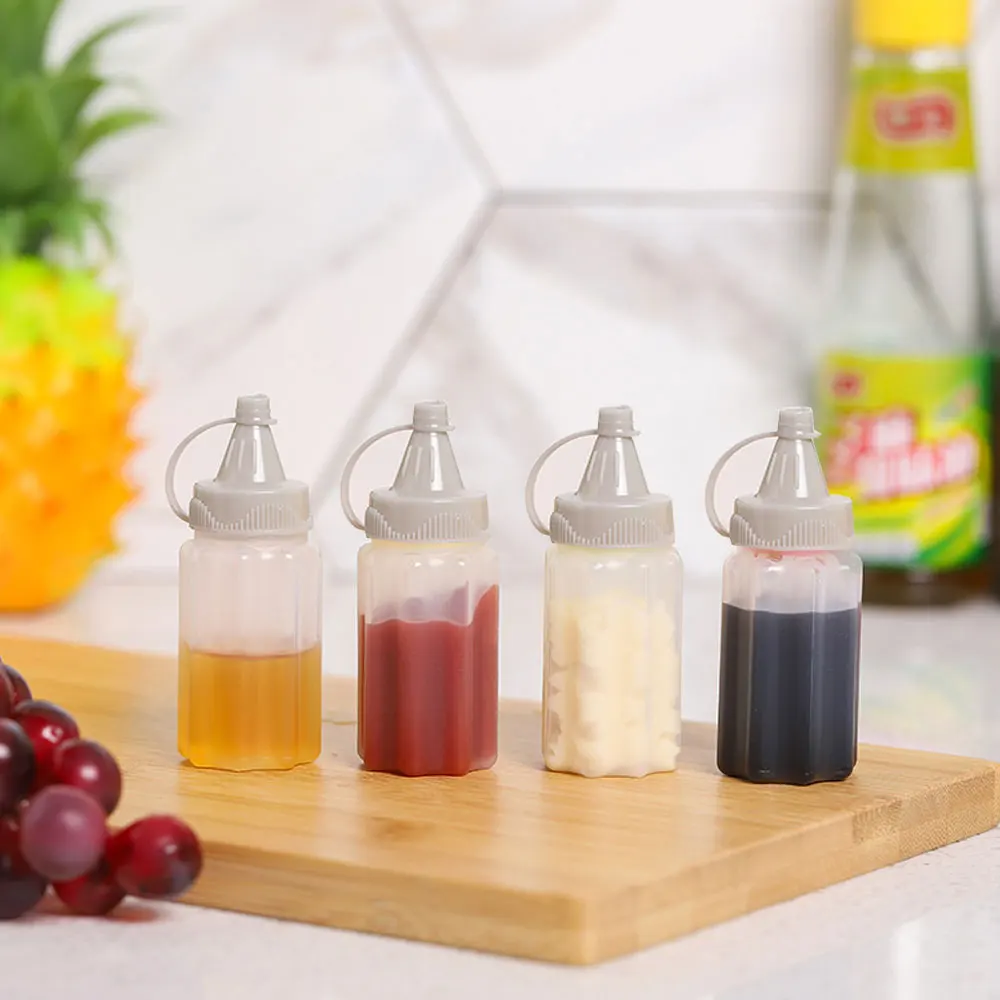 

4Pcs/set Transparent Spices Bottle with Lid Portable Mini Sauce Seasoning Box Dispenser Salt Spice Jar Sauce Squeeze Bottle