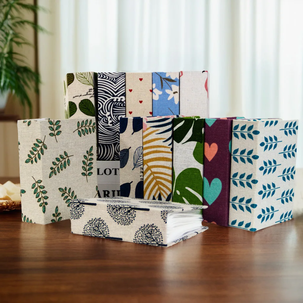 This exquisite 100-page photo album, adorned with printed fabric covers and measuring 6 inches, is an ideal holiday gift.