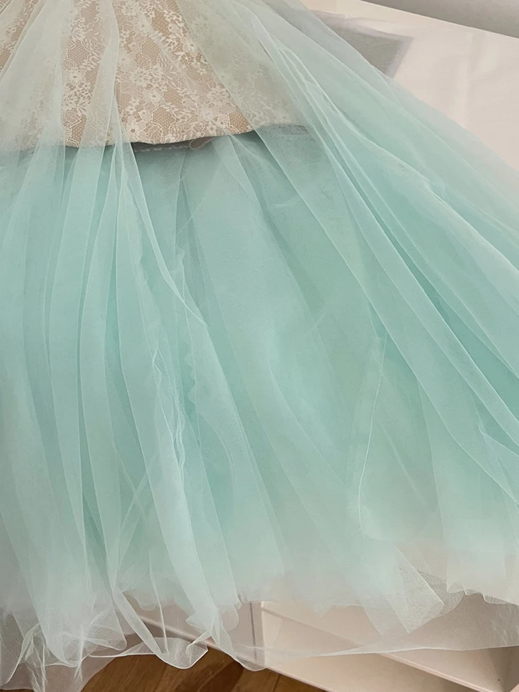 فستان دانتيل بحزام سباغيتي على الموضة الكورية للنساء لصيف 2025 بدون أكمام فستان طويل شبكي أنيق للحفلات والنوادي مع وسادة صدر