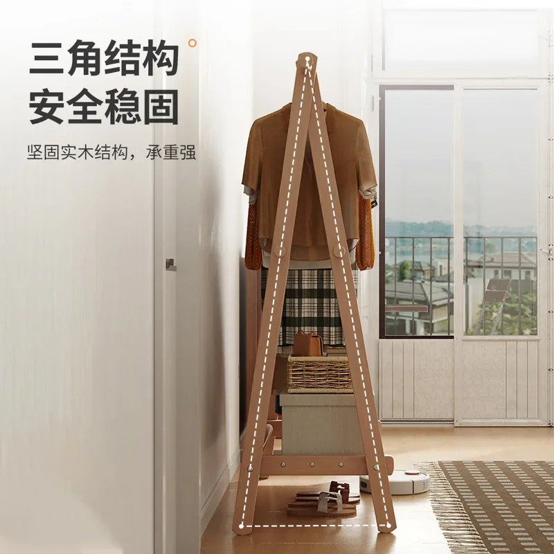 Foldable solid wood coat rack clothes rack floor-to-floor bedroom clothes rack bedside clothes artifact at night.