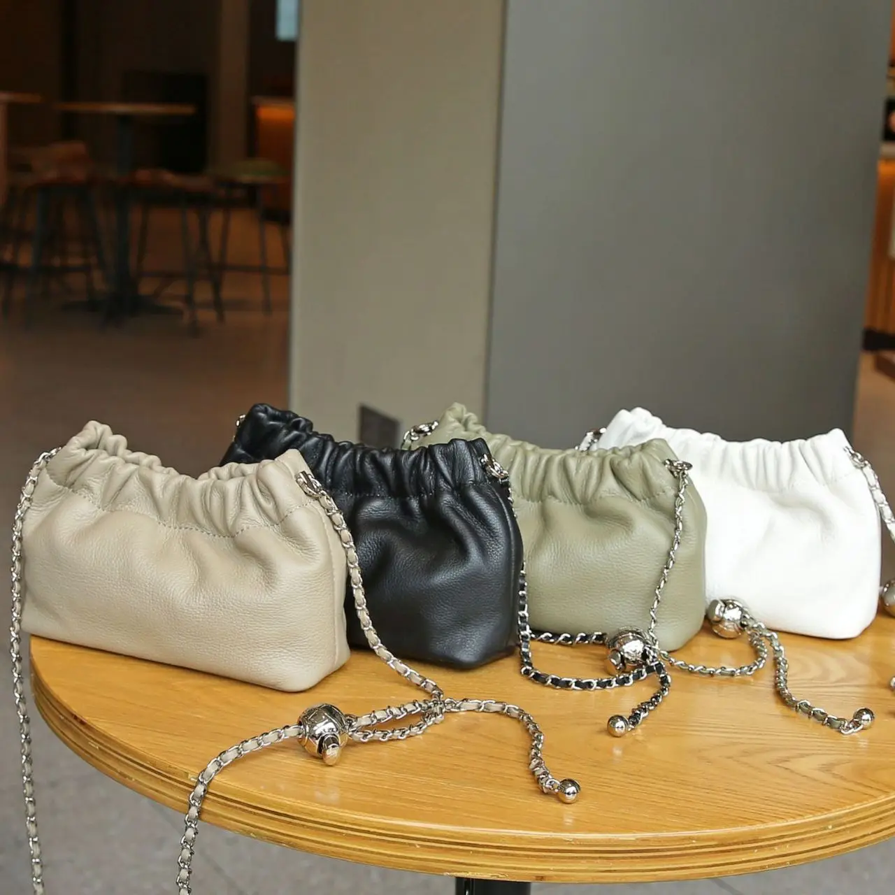 

First layer cowhide cloud dumpling bag 2025 new niche design small gold ball chain shoulder bag fashion women's crossbody bag