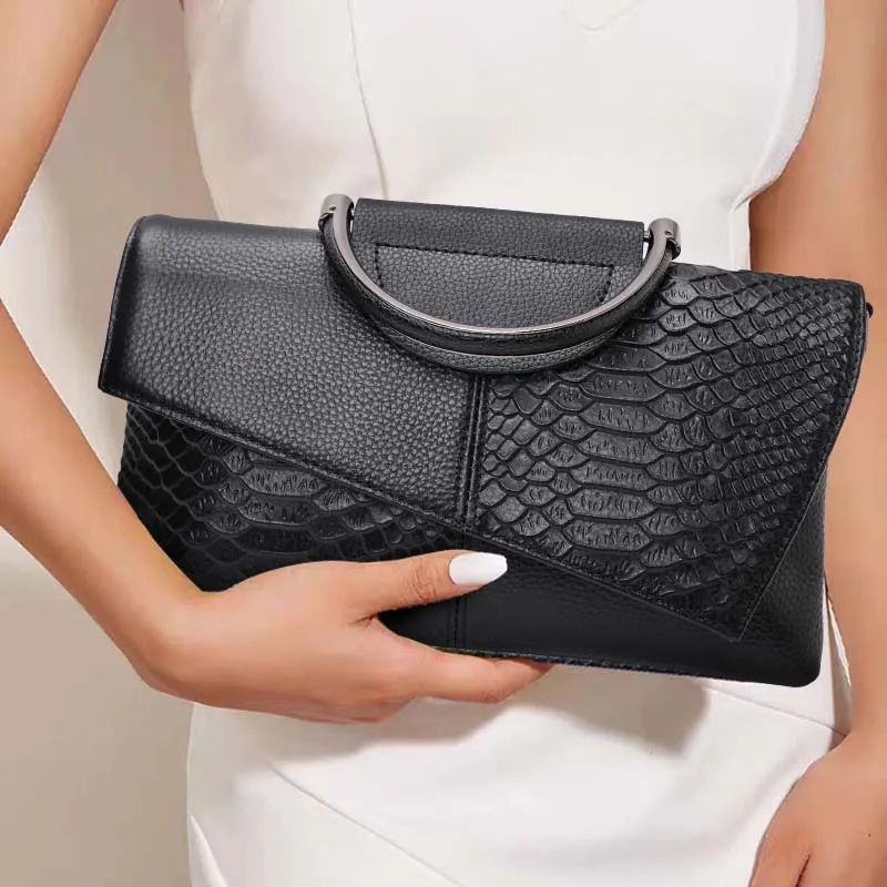 

Aidrani Patchwork Leather Envelope Bag: Metal Handle & Sophisticated Brand Style