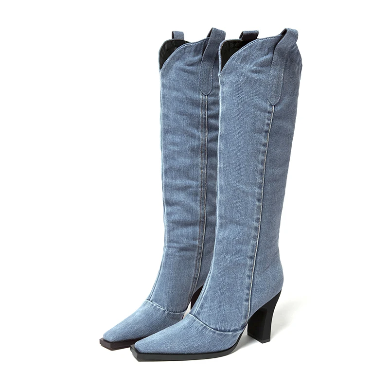 Casual thick heeled Western denim boots with a pointed toe that falls below the knee, oversized fashion boots