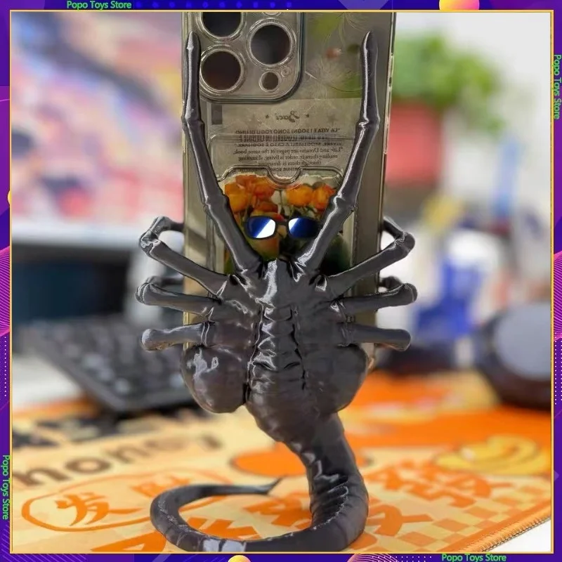 

Лидер продаж, 3d печатный инопланетянин, обнимающий лицо, держатель для телефона с насекомыми, модная игрушка-фигурка, подарок, персонализированный креативный Хэллоуин