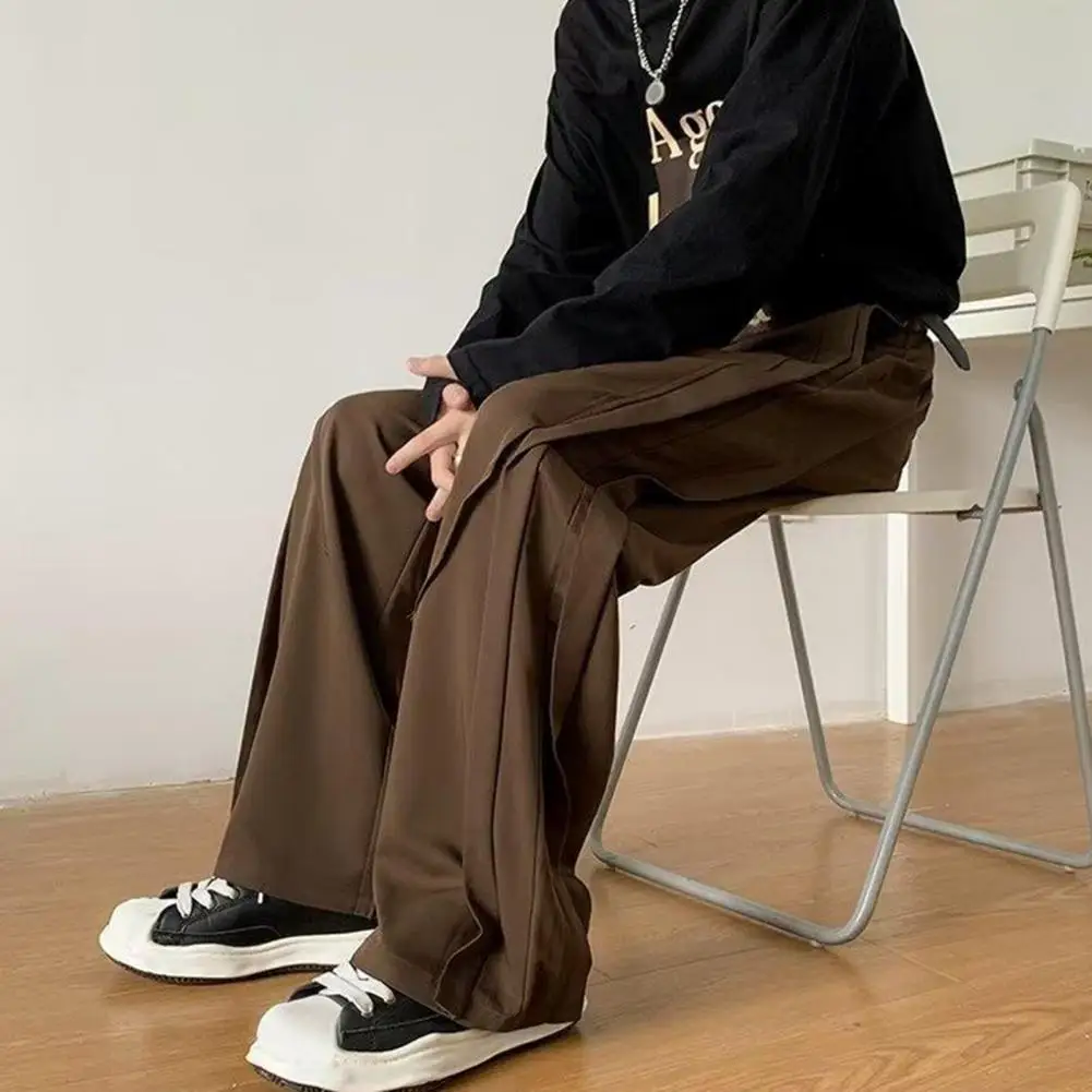 

Брюки мужские костюмные с широкими штанинами и глубоким шаговым швом