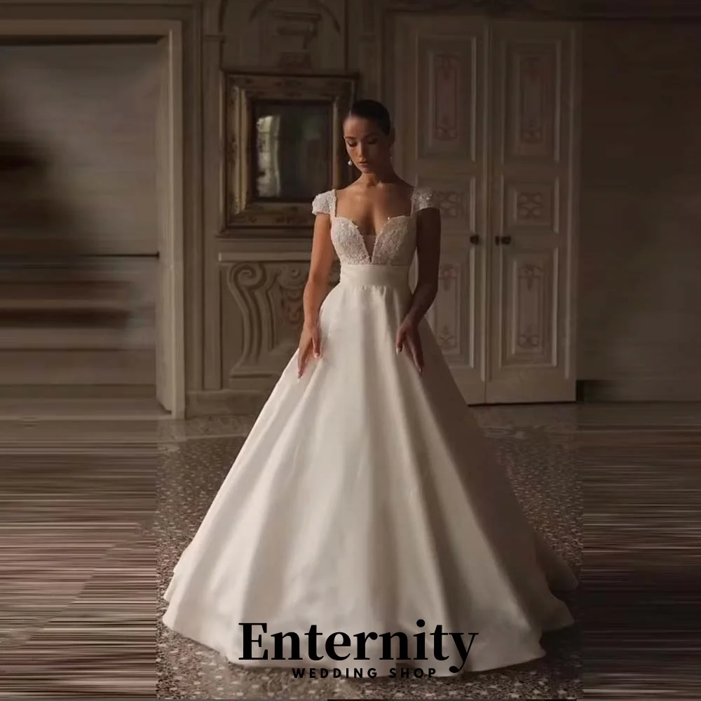 Maßgeschneidertes exquisites Kurzarm-Hochzeitskleid Charmantes V-Ausschnitt Sweep Zug Brautkleider Pailletten Brautkleid Vestidos De Noiva