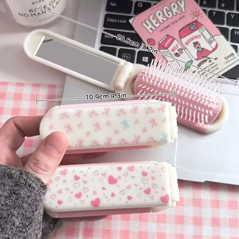 

Pink Bow Heart-Shaped Pattern Two-In-One Comb Mirror Foldable Hair Comb. Interesting, Elegant, Portable, Compact Travel Air-Cushioned Makeup Mirror. Anti-Static Massage, for Rich, Smooth Hair. Suitable for Curly Hair, Straight Hair, and Smooth Hair. Perfe